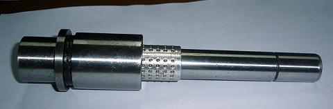 Custom guide post with ball retainer and bushing